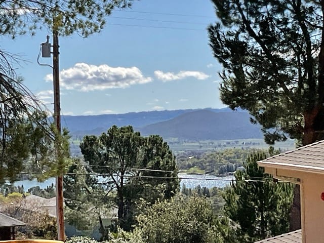 USA Houses have great lake and mountain views. This new construction home is one of them. From the yard you can see great lake view and a close up of the roofing and gables at 17867 Deer Hill Rd. Hidden Valley Lake CA
