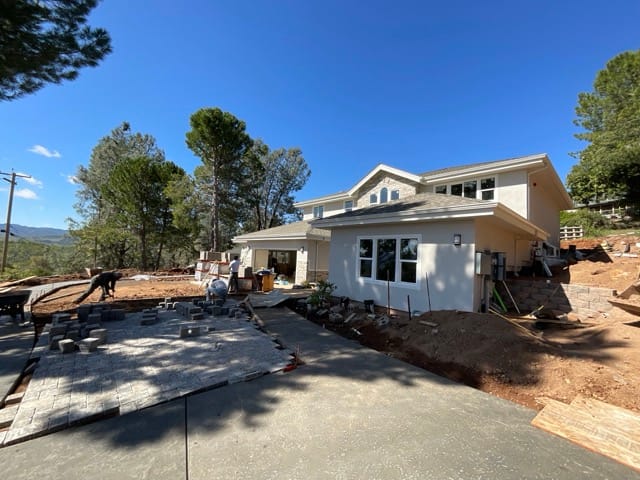 View of the attached garage and driveway at 18767 Deer Hill Rd. Hidden Valley Lake CA new construction home almost complete