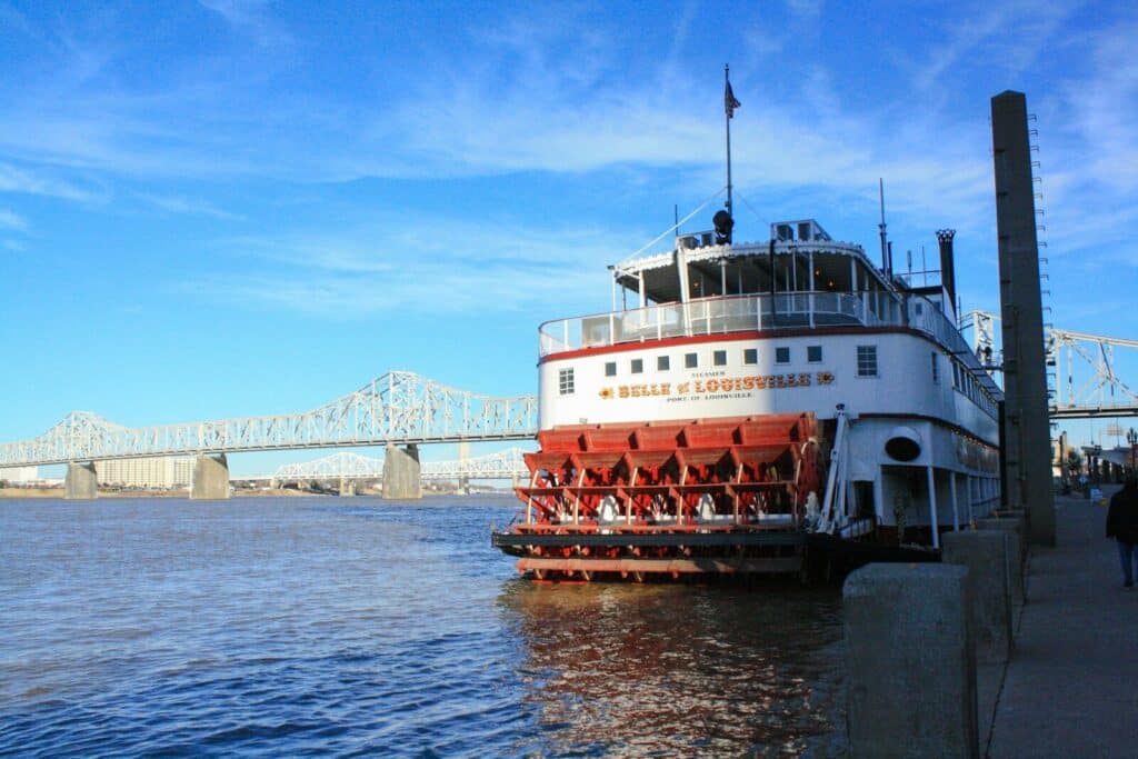 Louisville real estate can be seen on this white and red ship on sea under blue sky during daytime
