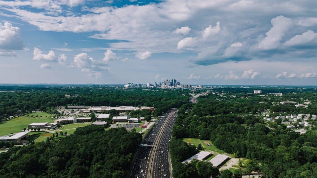 Not Greensboro real estate but a breathtaking aerial view of Atlanta, Georgia's city skyline and highway.