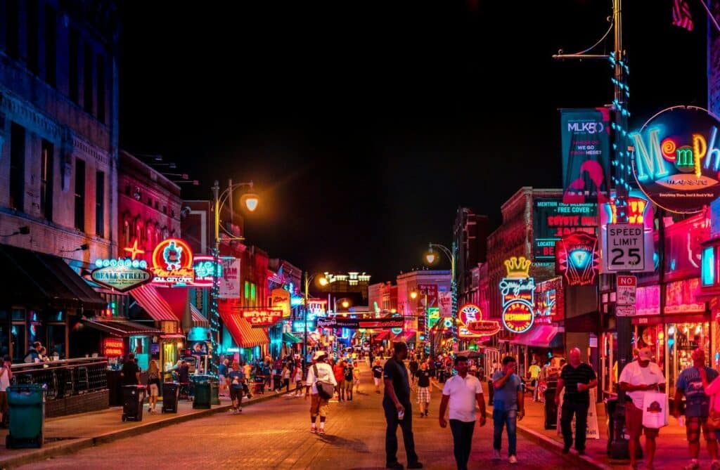 Walking in Memphis road with buildings and crowding people