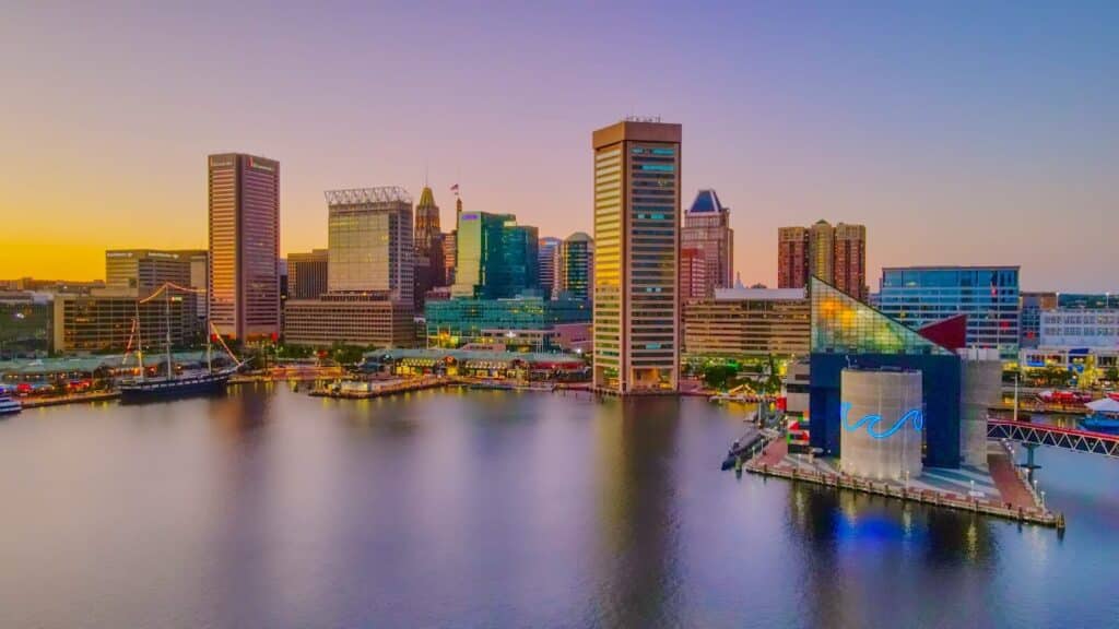 Baltimore MD city skyline across body of water during daytime