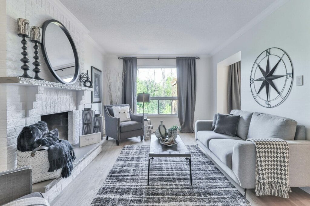Living room with white and black plaid sofa near window