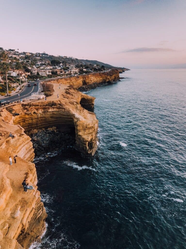 road on sea cliff during daytime in San Diego CA