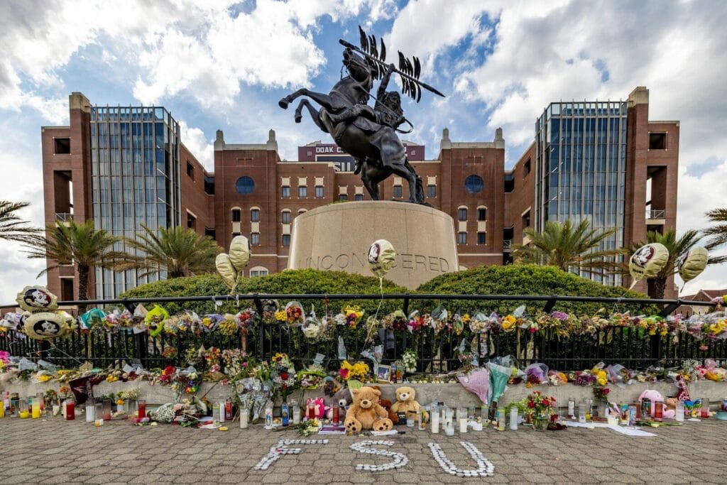 Flowers are placed at the florida state university memorial. you can graduate then look for new homes for sale in the Tallahassee real estate