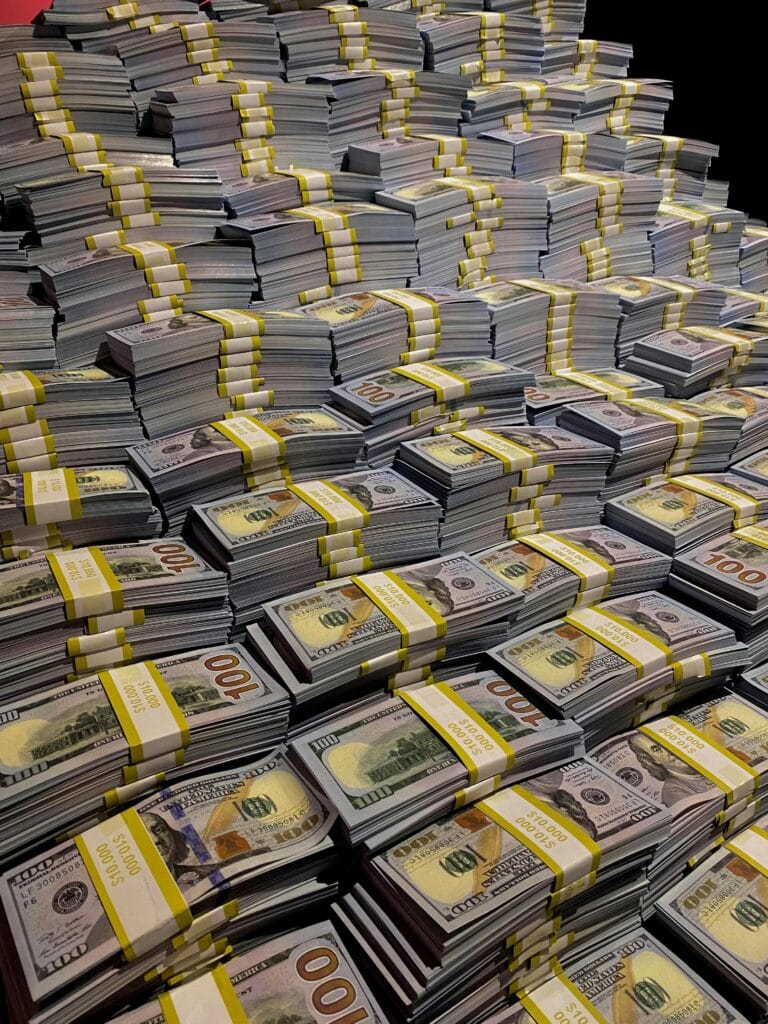 USA Lending. Funding. Large piles of 100 US dollar bills neatly stacked, symbolizing wealth and financial abundance.