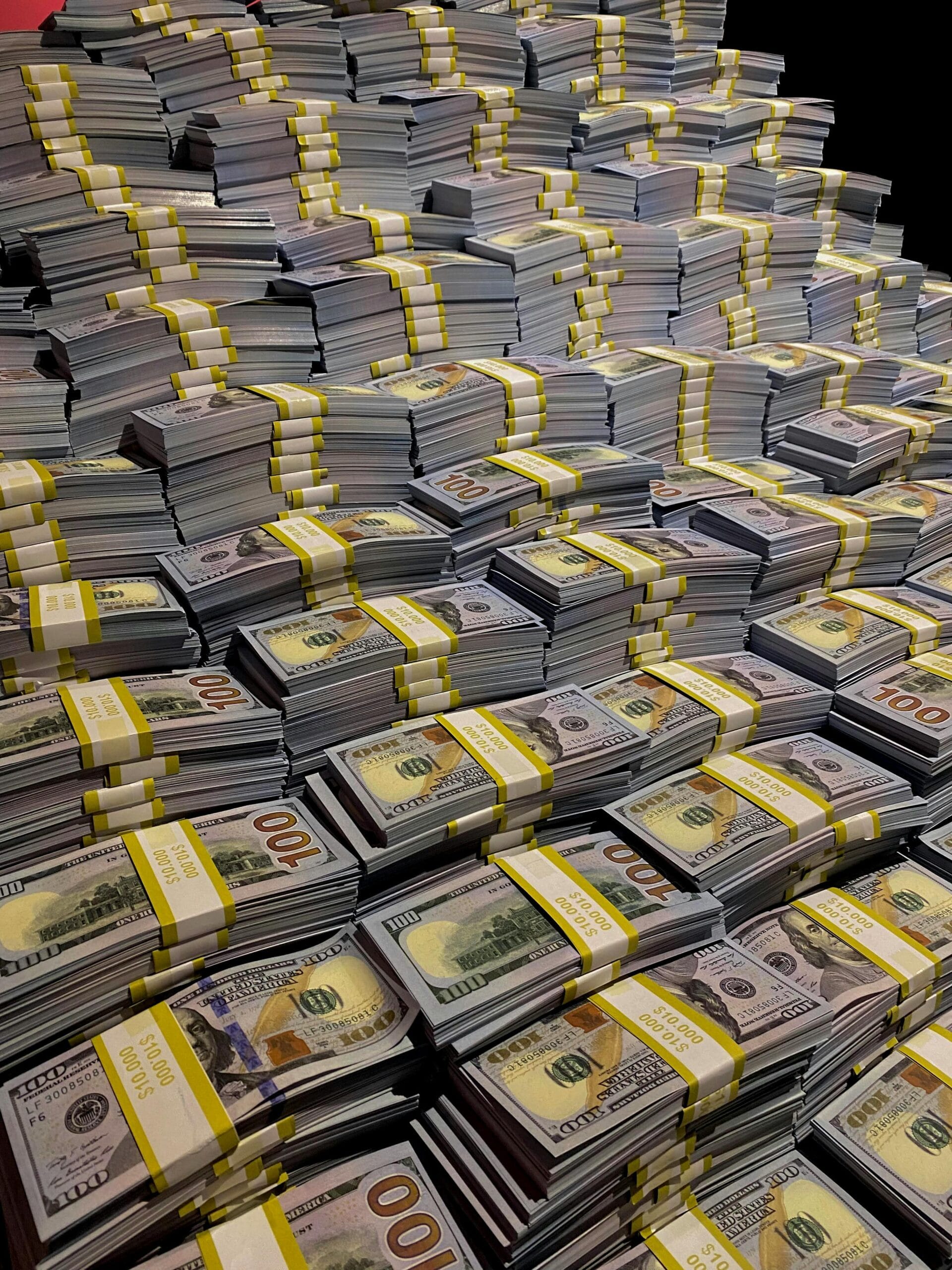 USA Lending. Funding. Large piles of 100 US dollar bills neatly stacked, symbolizing wealth and financial abundance. Cost of waiting to buy a house, financing rental properties