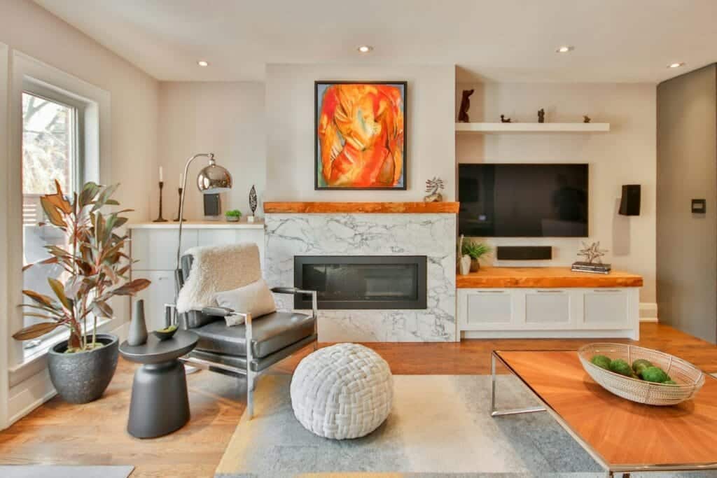 A living room filled with furniture and a fire place