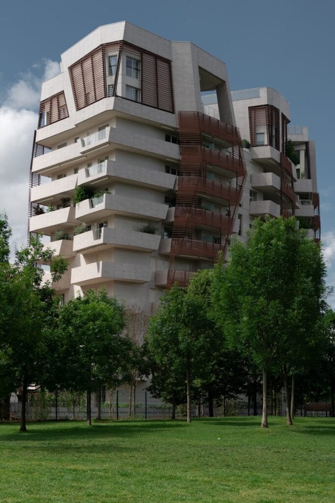 A tall condo building with balconies on top of it