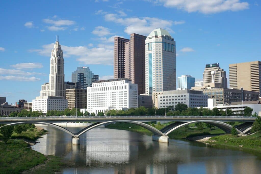 Columbus Ohio showing a bridge over a river with a city in the background